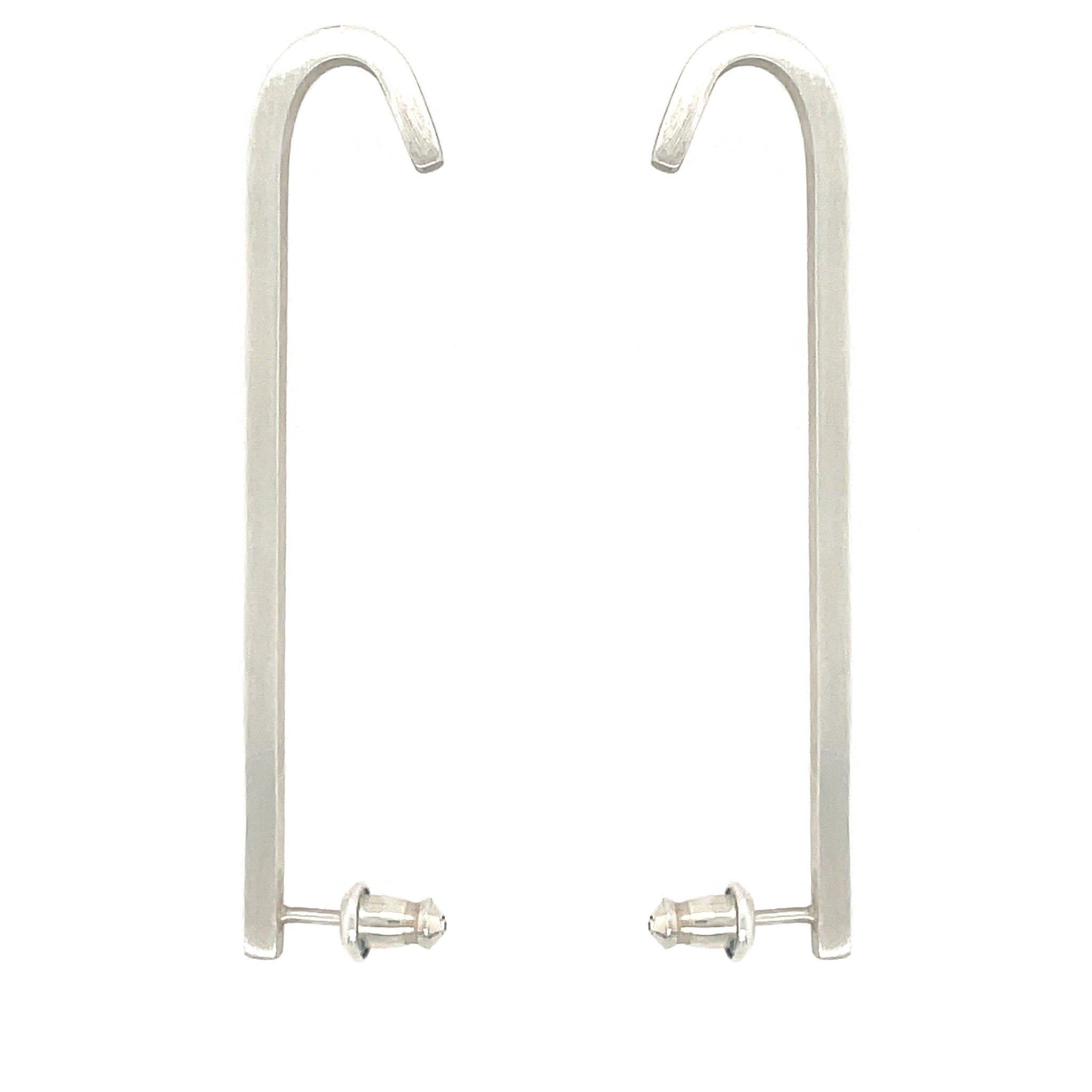Image shows 2 upside down J shaped earrings made out of sterling silver and that has a matte brushed finish. Bullet style earring backs for added support. The Ear bars are made out of square wire, which gives this earring 4 flat sides.